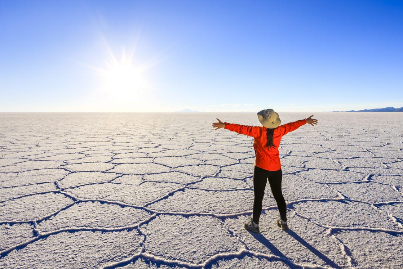 Female tourist on Salar de Uyuni, Altiplano, Bolivia