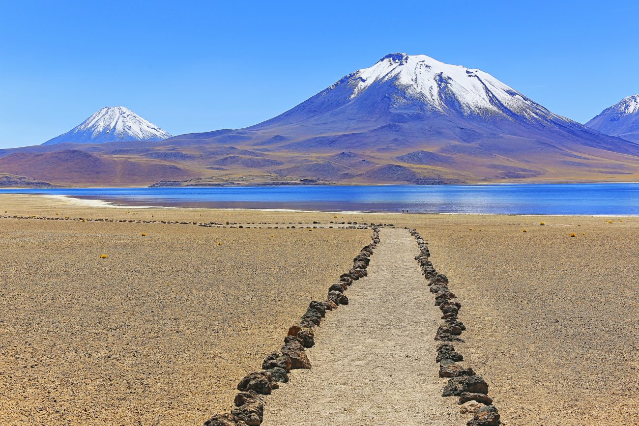 trekking trail path to Lagunas Miñiques and Miscanti - Lakes and snowcapped Volcanoes mountains - Turquoise lakes and Idyllic Atacama Desert, Volcanic landscape panorama – San Pedro de Atacama, Chile, Bolívia and Argentina border