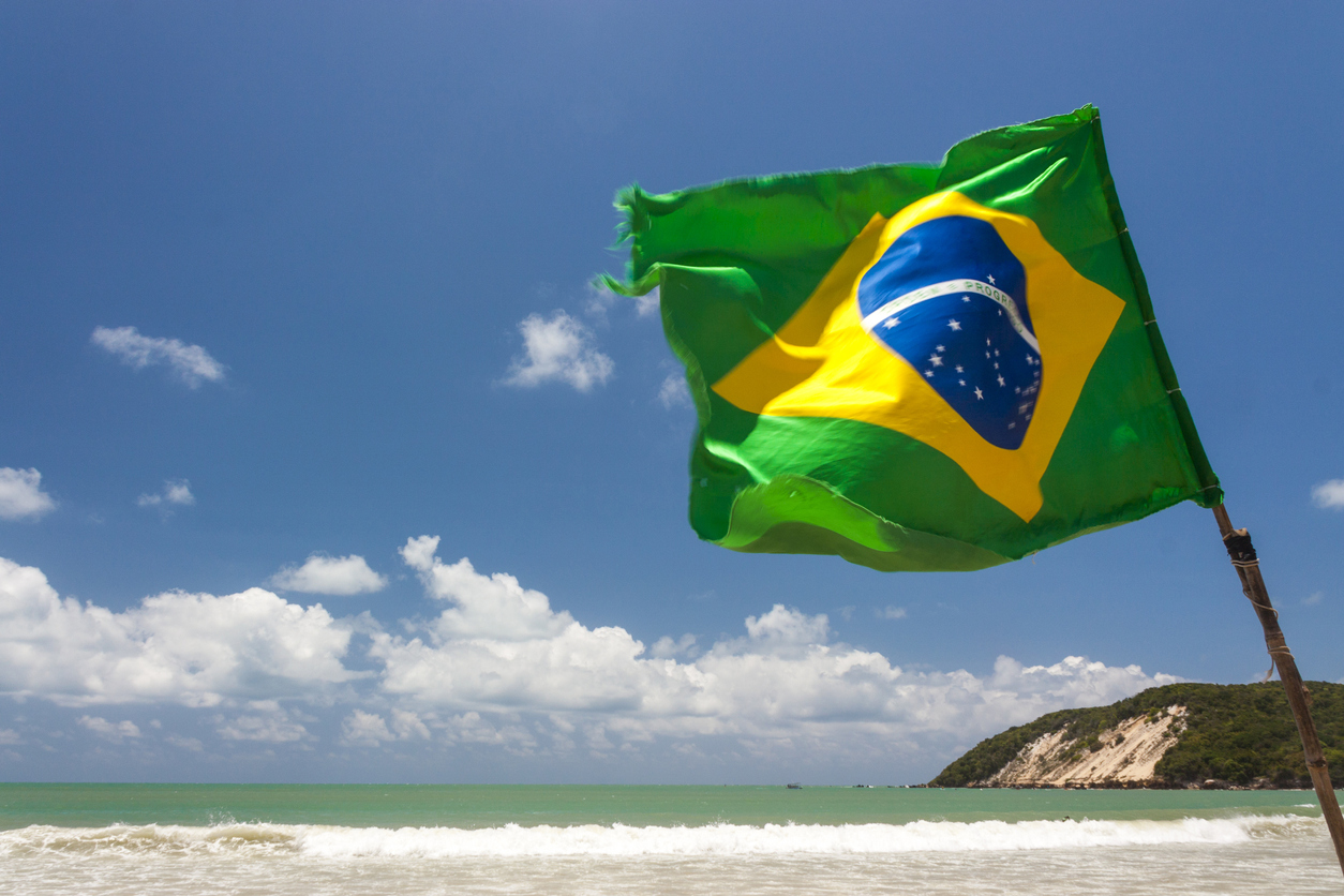 Brazilian Waving flag in Ponta Negra dunes beach in Natal, Brazil